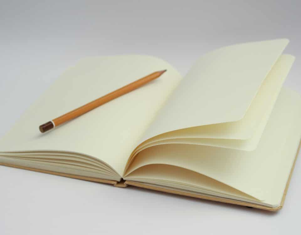 Notebook and Pencil for writing an essay