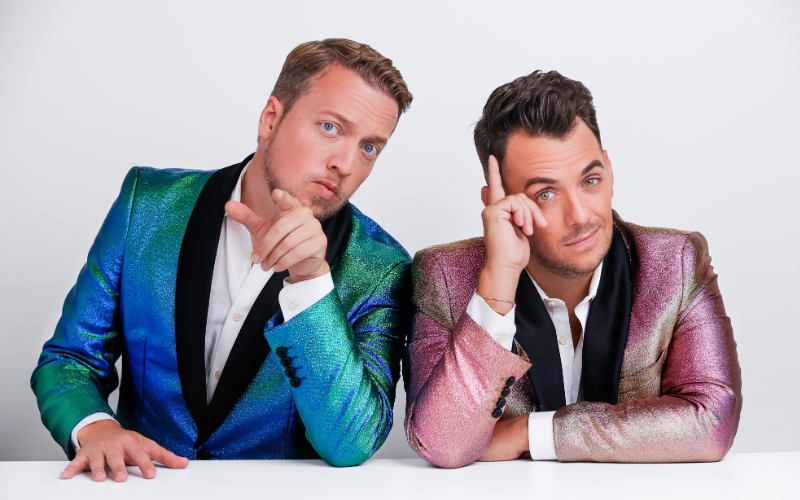 Two men in colorful dinner jackets looking at the camera