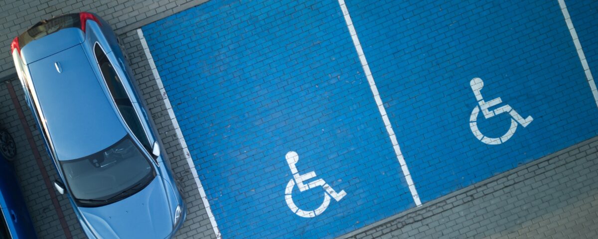 overhead view of accessible parking spaces that are painted blue