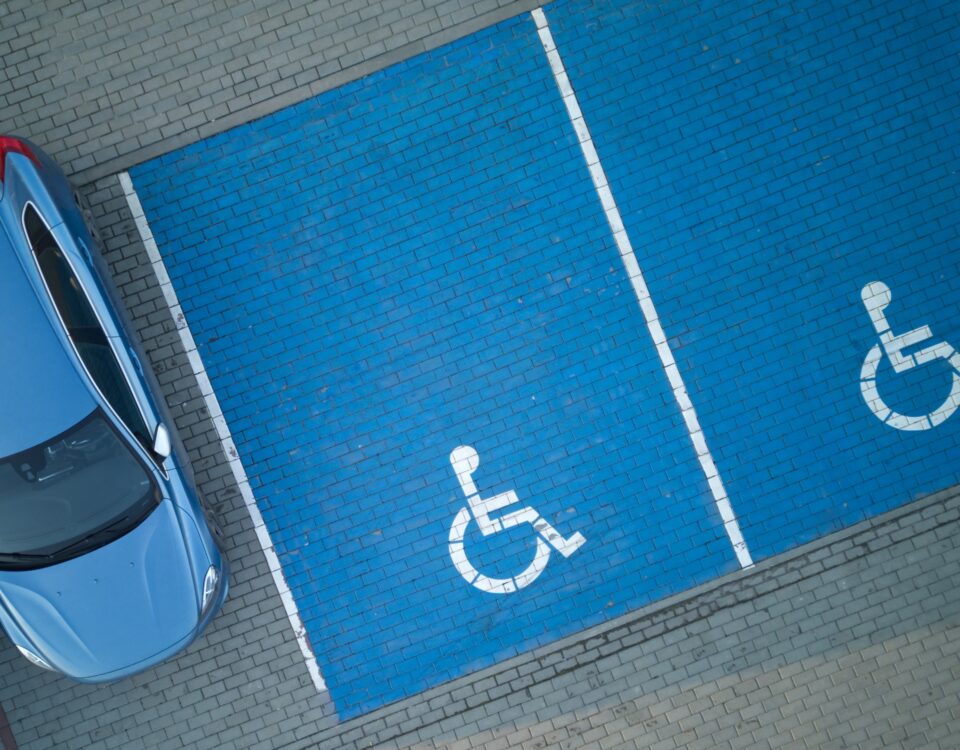 overhead view of accessible parking spaces that are painted blue