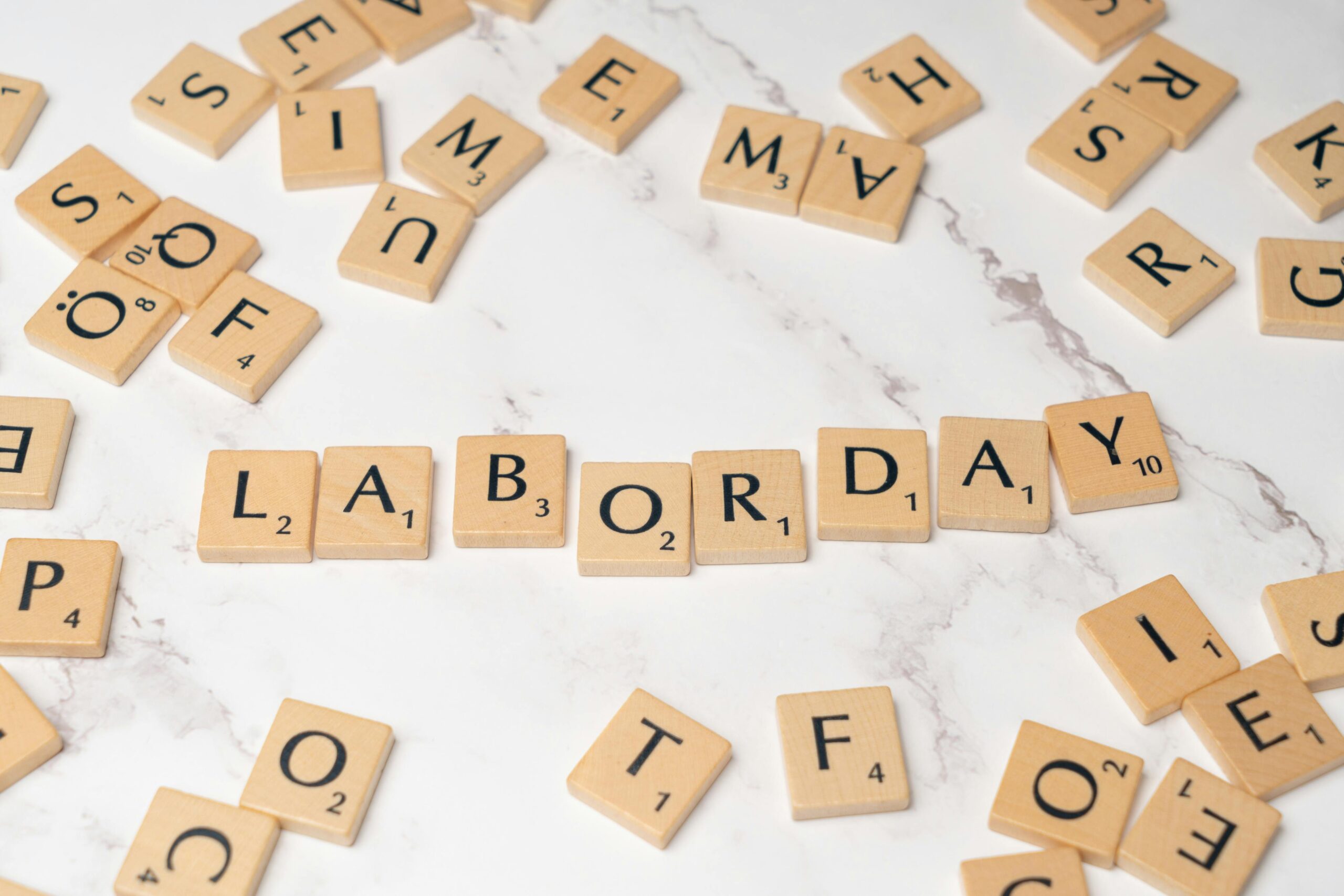 game tiles with letters on them spelling out labor day