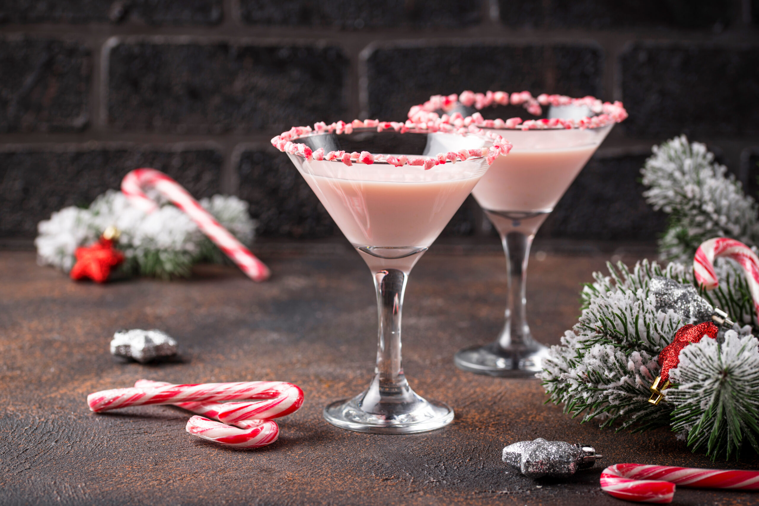 Pink peppermint martini with candy cane rim