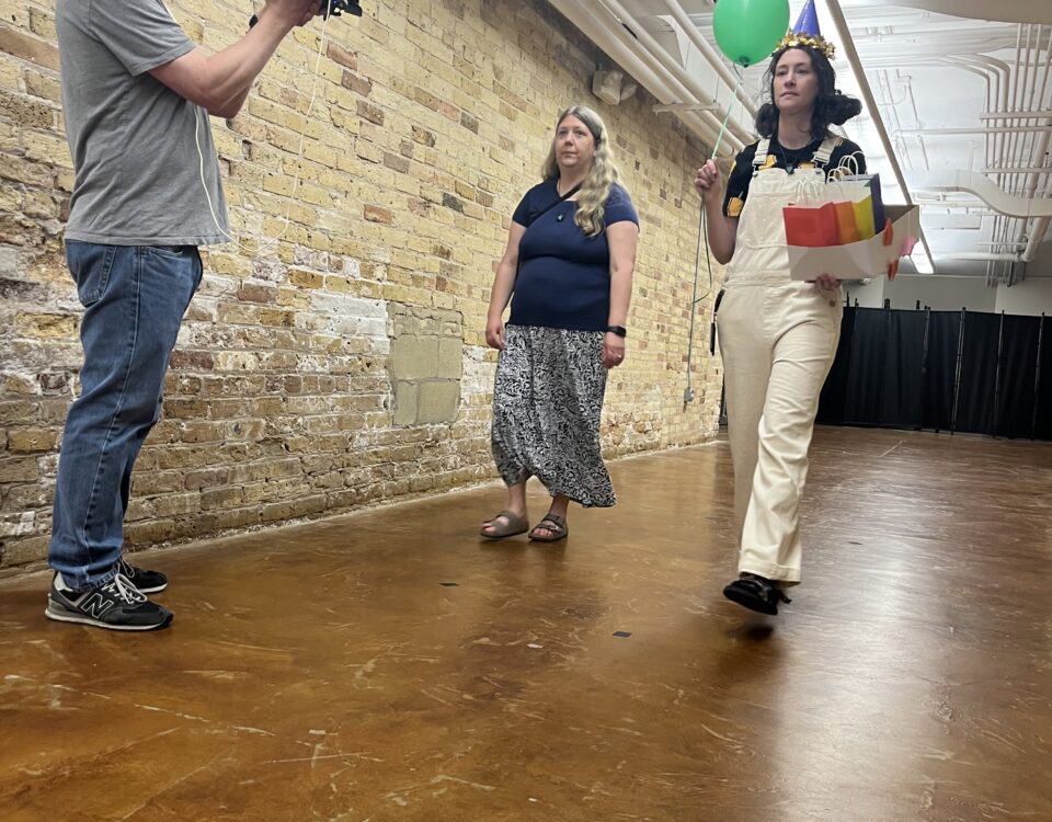 Two actors being filmed