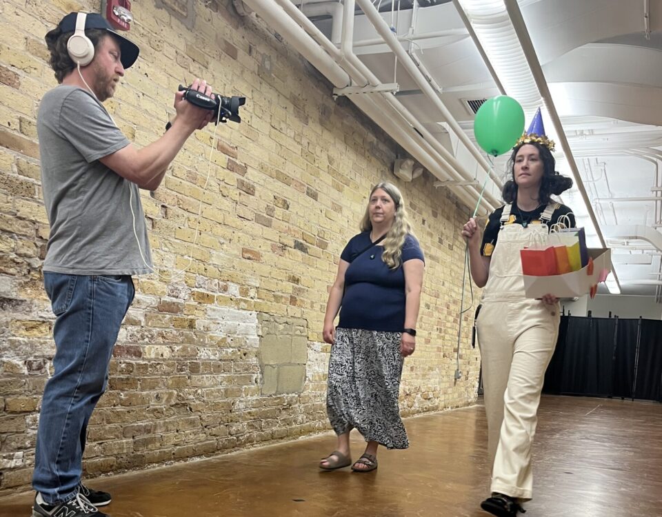Two actors being filmed