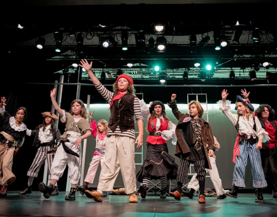 Children pose as pirates