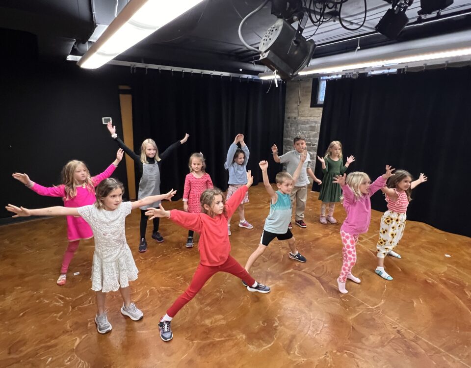 Kids holding arms up
