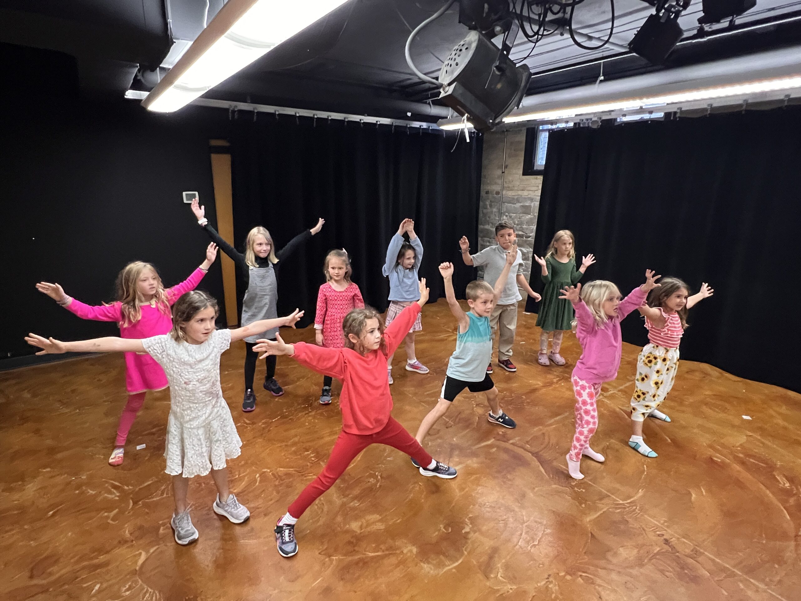 Kids holding arms up