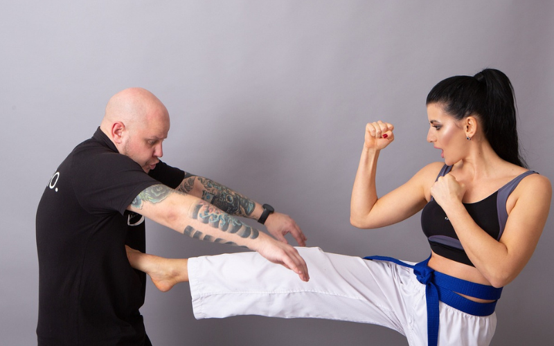 woman kicking attacker