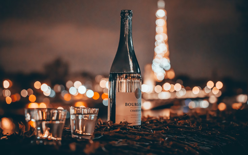 wine bottle and glasses in paris