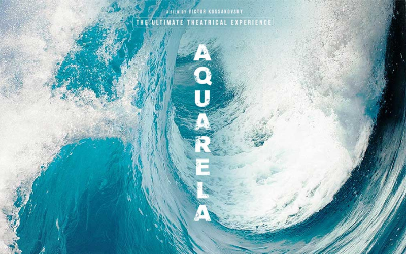 Official poster for the film 'Aquarela'- it's an image of a huge, blue wave with "Aquarela" written going vertically down the image