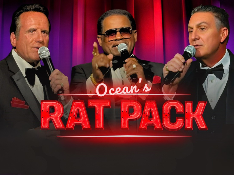 An image of the members of Ocean's Rat Pack. They are dressed in tuxedos and singing into microphones during the Rat Pack Tribute Show